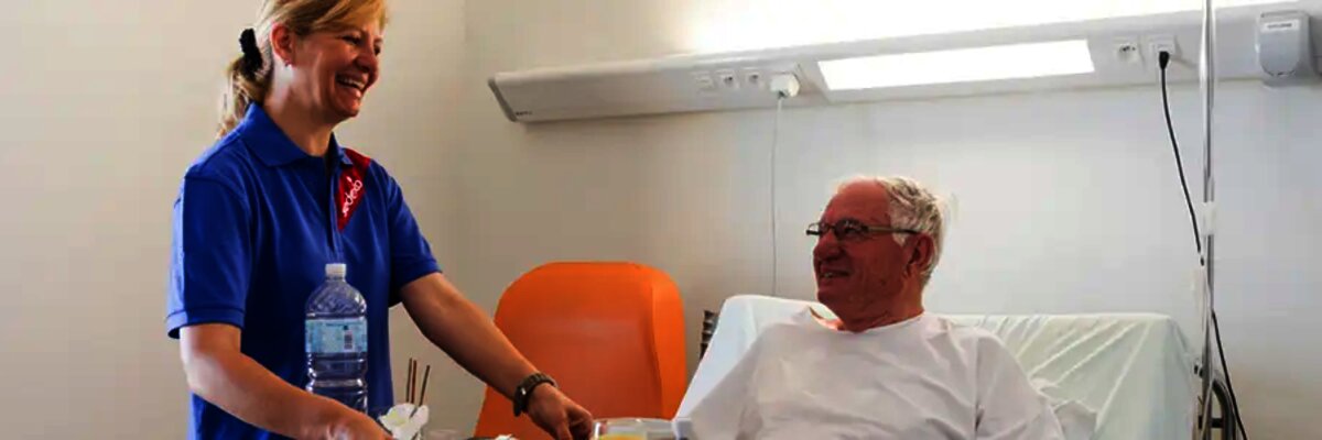 EDI services for Sodexo - woman serving food in hospital