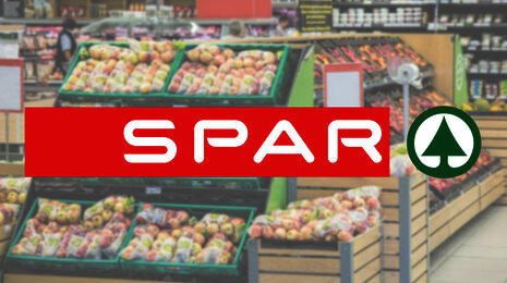 spar logo in a blurried grocery store