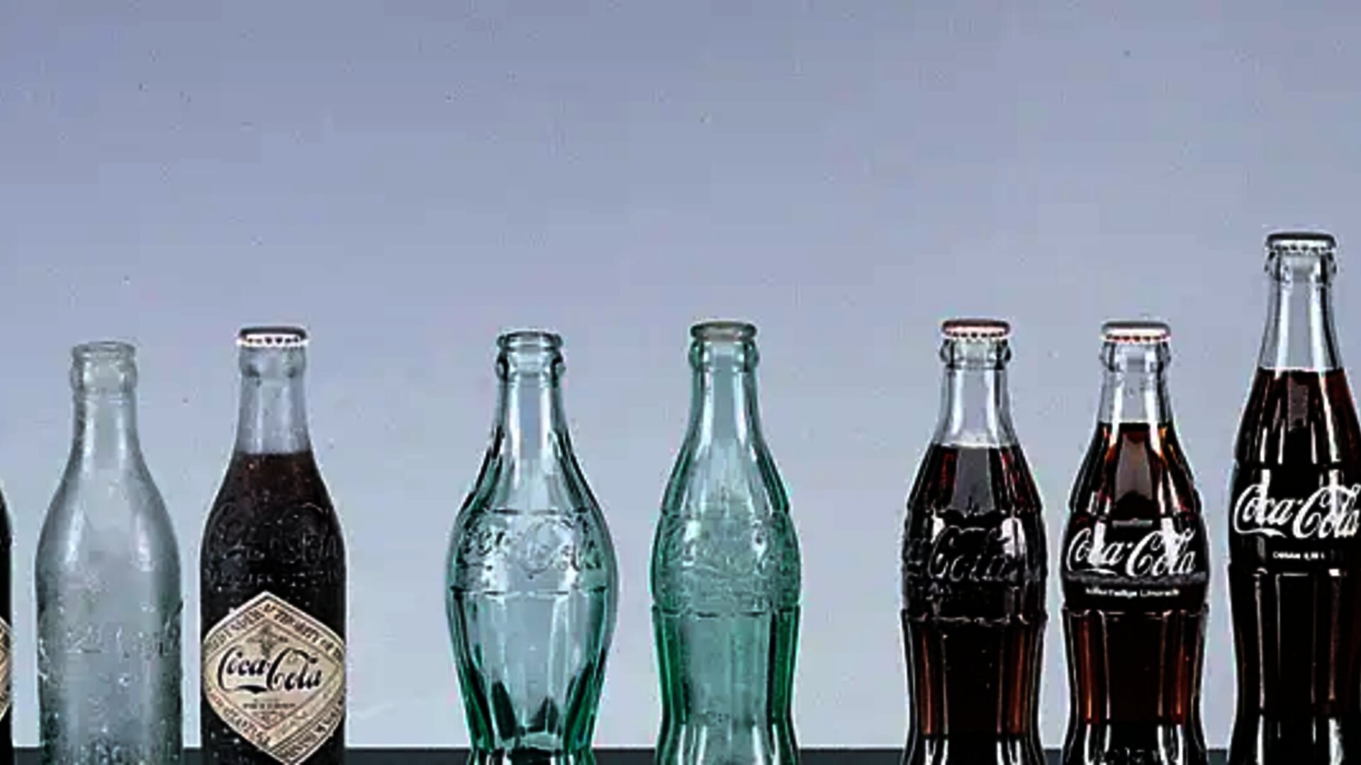 different-bottles-empty-and-with-coca-cola