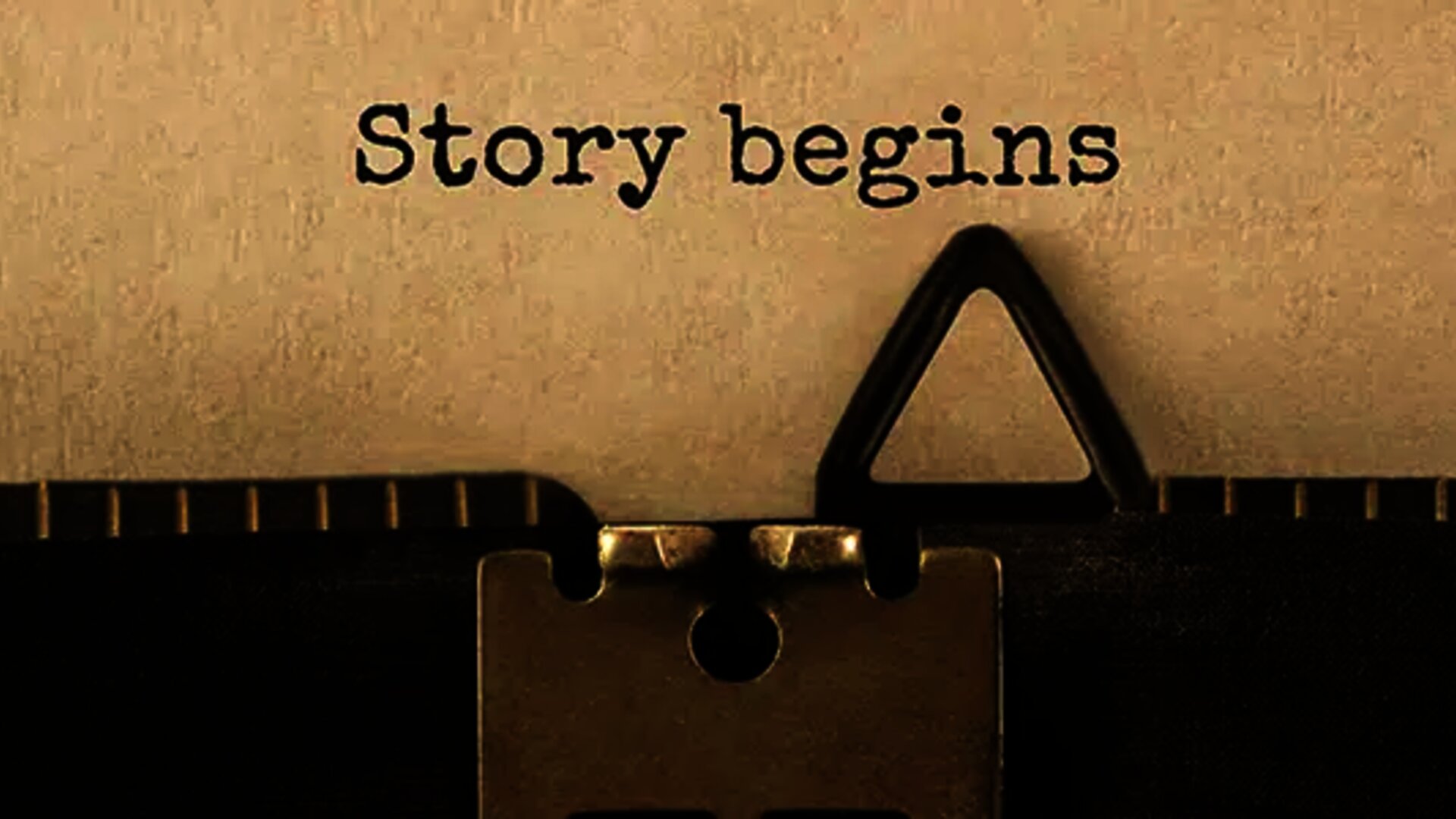  a typewriter with the words 'Story begins' typed on a sheet of paper