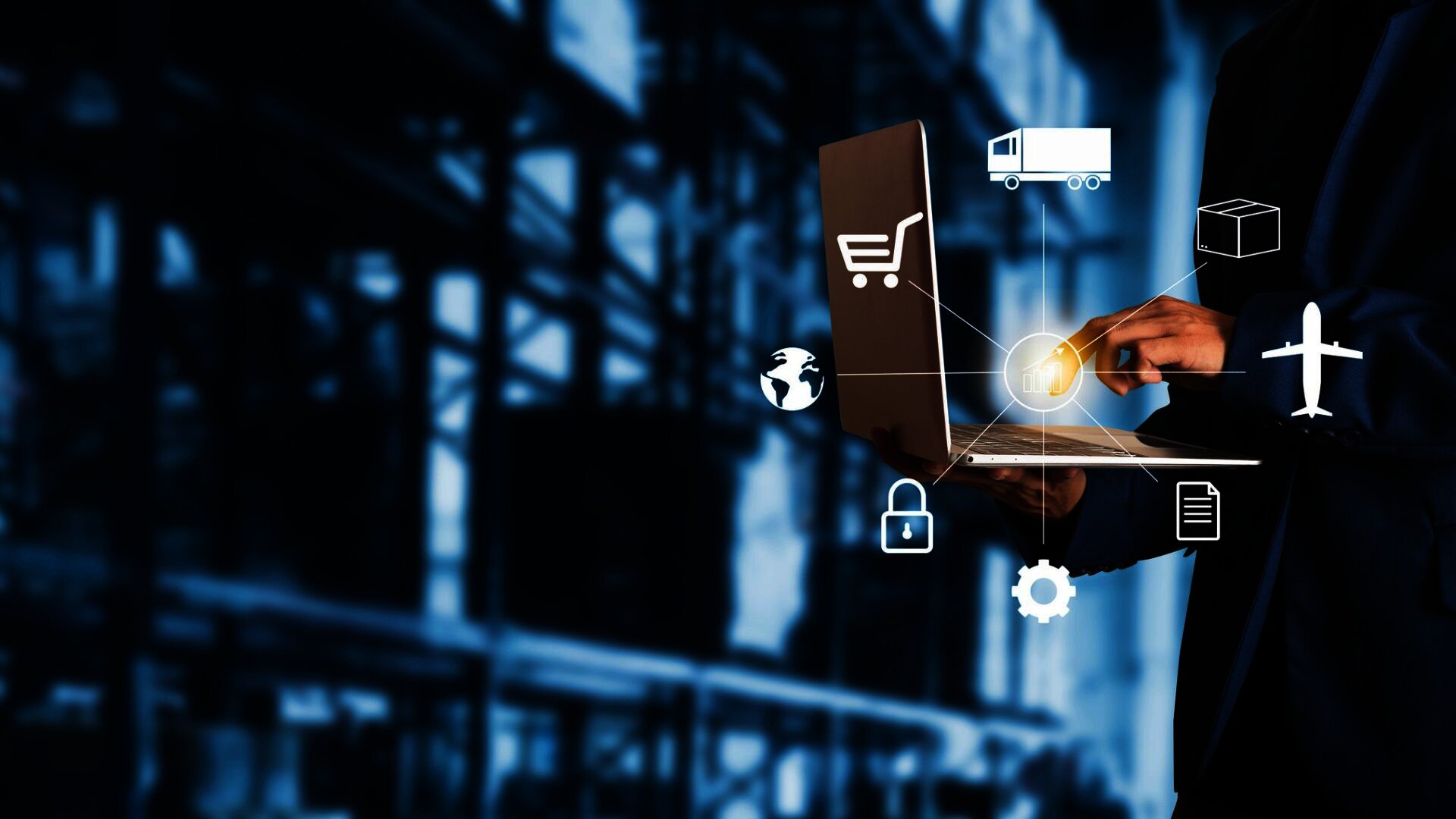 Person using a laptop in a warehouse with overlay icons representing global shipping, logistics, and e-commerce solutions