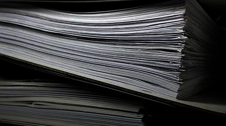 Close-up of thick paper folders filled with documents