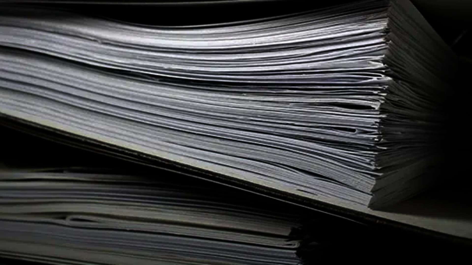 Close-up of thick paper folders filled with documents