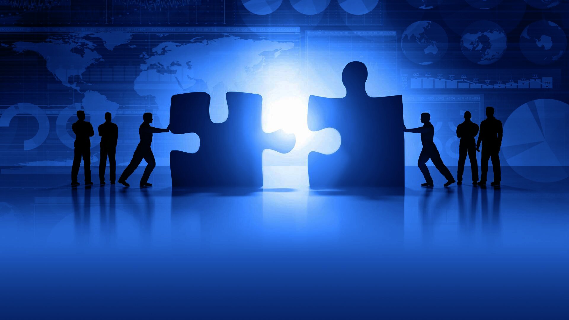 people working together to connect two large puzzle pieces. The background includes abstract graphics, such as world maps and data visualizations, giving a sense of global collaboration, teamwork, and problem-solving