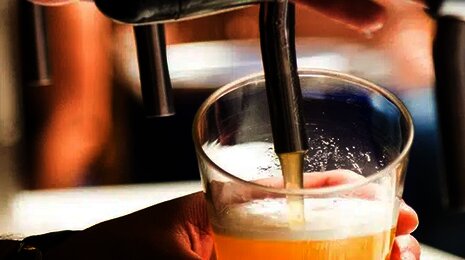 Pouring beer in a glass