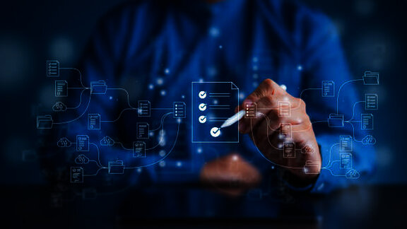 Person interacting with a digital checklist and connected process workflow icons.