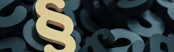 W miejscu centralnym na grafice znajduje się symbol paragraf "&sect;"