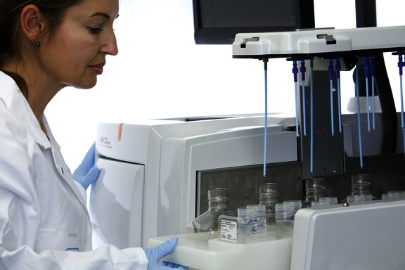 woman in laboratory with microscope