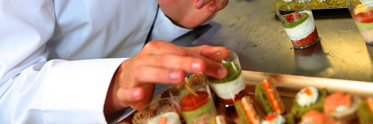 Hands of man preparing catering
