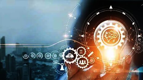 Hand holding a glowing lightbulb with digital icons, gears, and a city skyline, symbolizing innovation