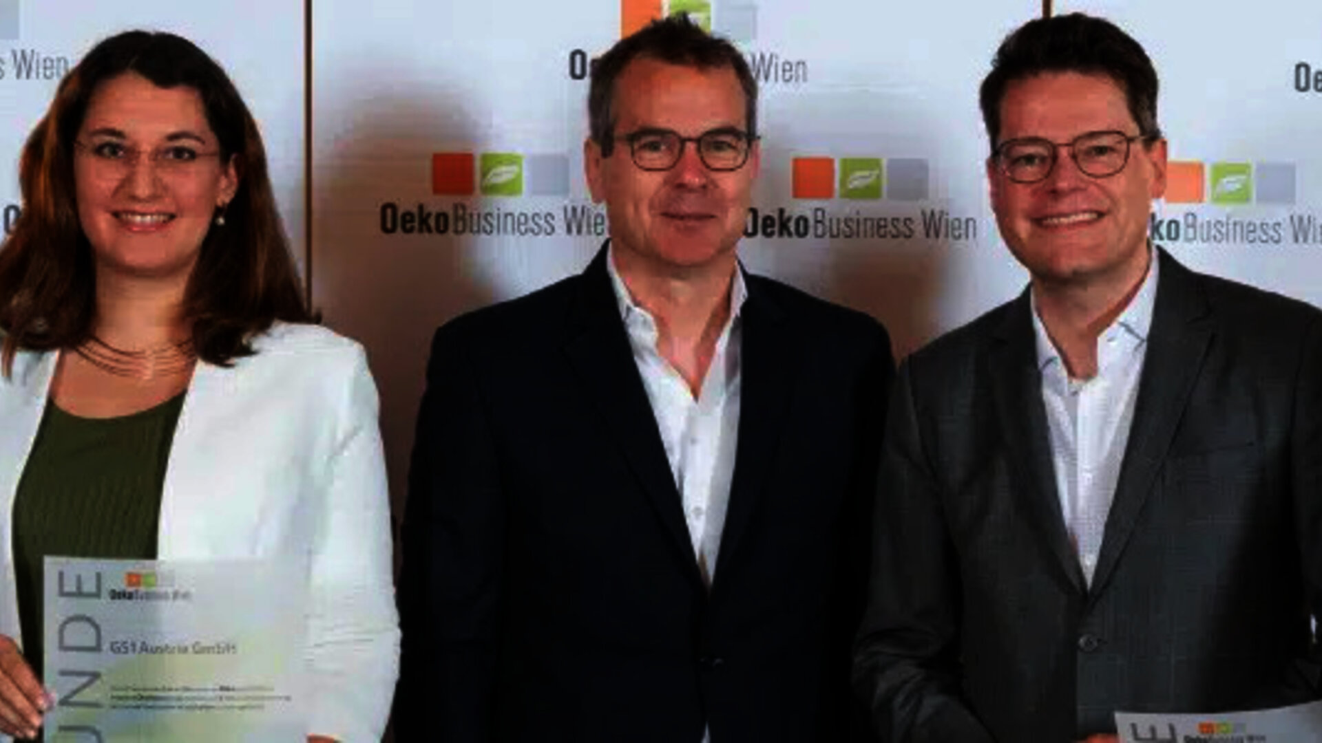 OekoBusiness winners posing in front of promo wall