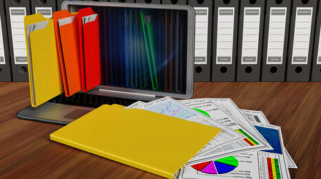 Digital folders emerging from a laptop, representing electronic document management and organization